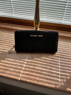 Michael Kors Black Zip-Around Saffiano Wallet with Gold Logo